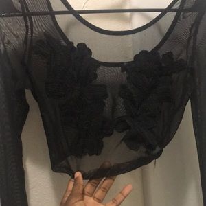 Black sheer crop top with floral design on front